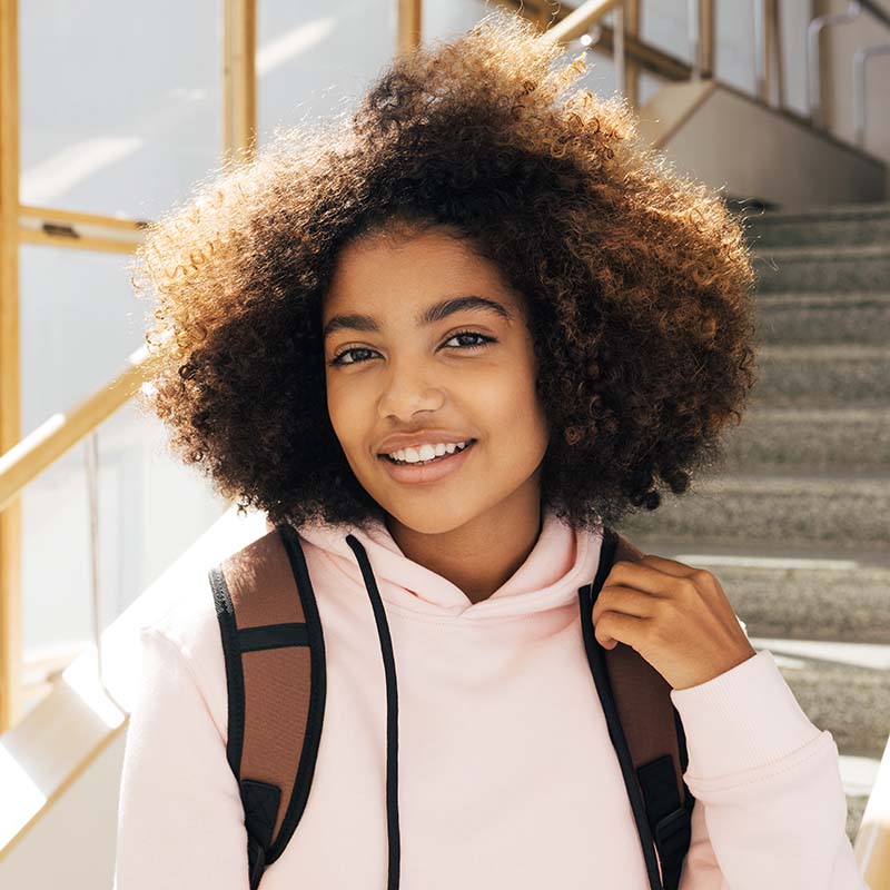 portrait of a beautiful girl standing in high scho 5FKLR6M